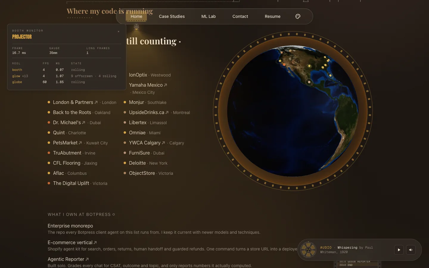 The booth monitor open over the home page globe, listing the glow, globe and booth reels with their frame rates, costs and states